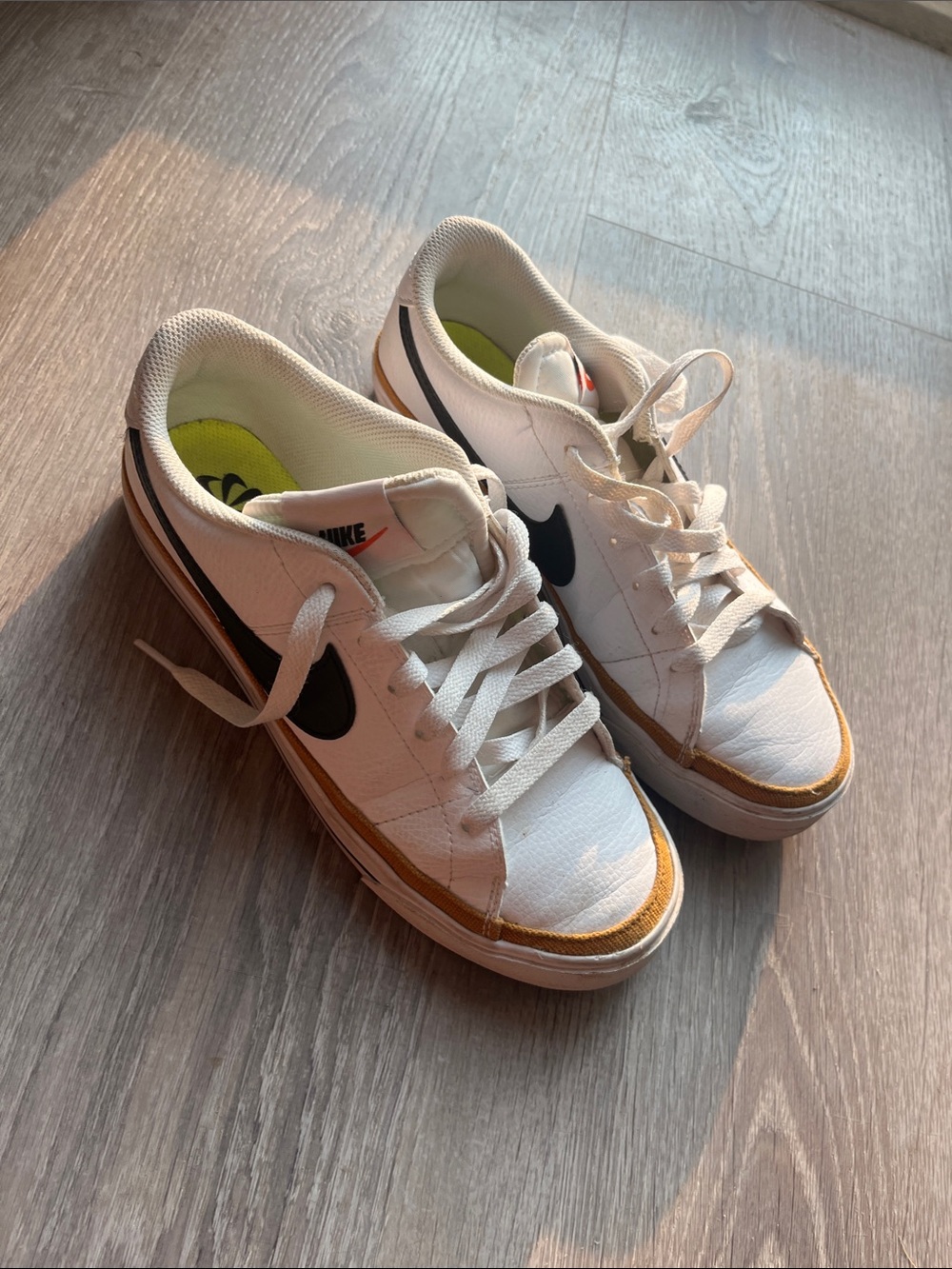 Nike Women’s White Sneakers with Black Swoosh and Tan Accent